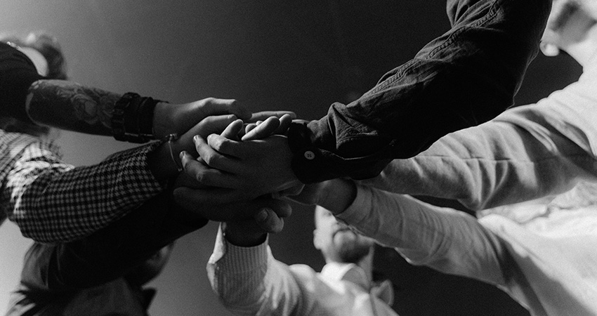 group of people holding hands