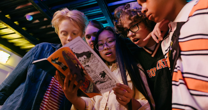 kids looking at comic book