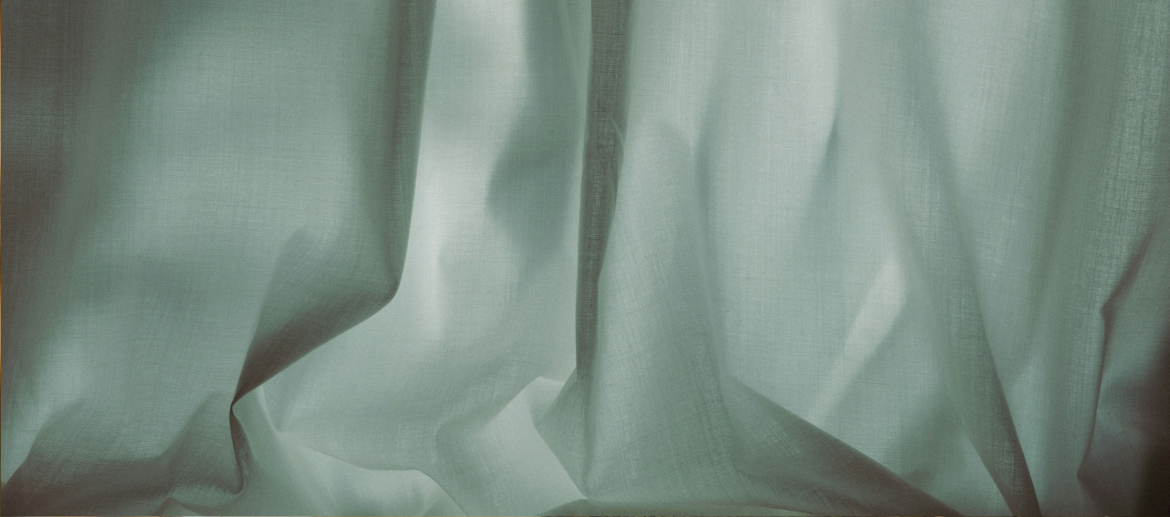 Ethereal close-up of grey curtains