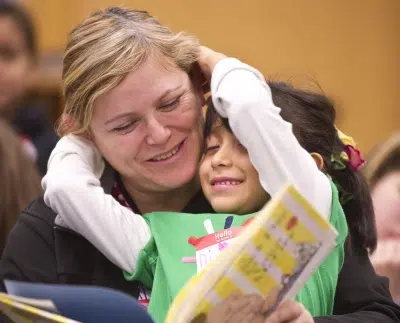 Woman reading to child